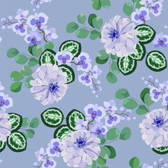 Delicate orchids and chrysanthemum on a gray background.