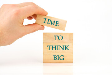 Business and Time to think big concept. Time to think big symbol on wooden blocks on a white...