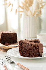 Fresh homemade chocolate sponge cake on wooden board