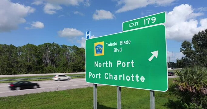 Interstate freeway exit sign in Florida, USA. I-75 highway interchange with direction to North Port and Port Charlotte