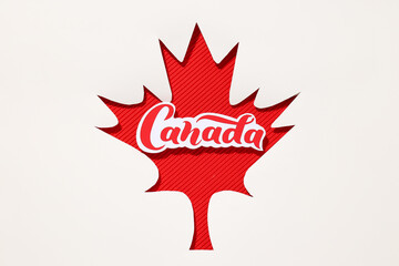 Red maple leaf with the word Canada on a white background