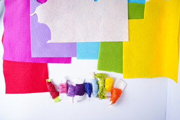 A set of needlework made of multicolored felt and thread