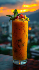 Fruit smoothie against a cityscape at sunset, perfect for lifestyle or travel advertisements.