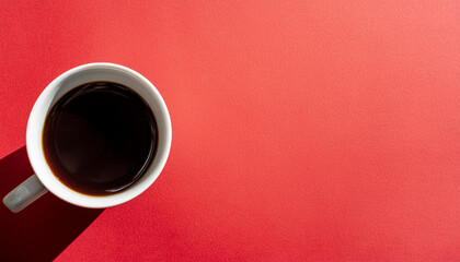 Coffee cup from above on a bold red background, copy space on a side