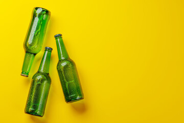 Beer bottles on yellow background