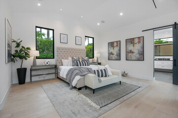 Spacious bedroom with multiple windows in a modern new construction home in Los Angeles