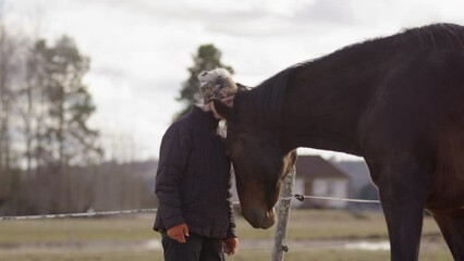 Horse initiates physical interaction with woman during equine-assisted therapy