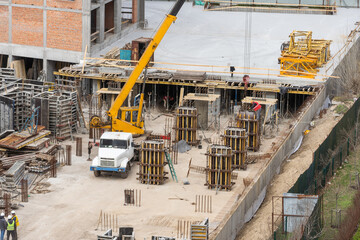 Aerial view of construction site, construction of new building in residential area.