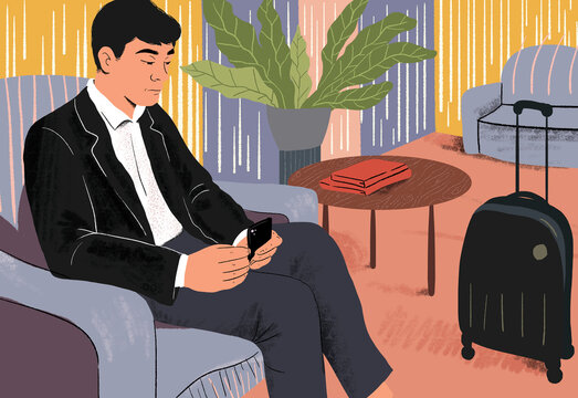 Businessman with smart phone waiting at airport lounge