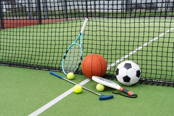 Naklejka premium Sport games background - basketball, soccer ball, rackets, sneakers - copy space
