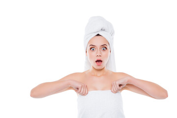 Portrait of shocked frustrated woman after shower with towel on head holding keeping towel with...