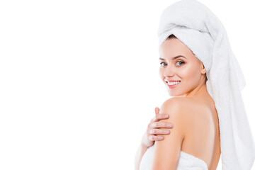 Portrait with copyspace of charming half turned woman after shower with towel on head touching...