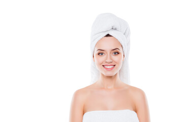 Portrait with copy space of charming pretty woman with beaming white smile after bath having turban...