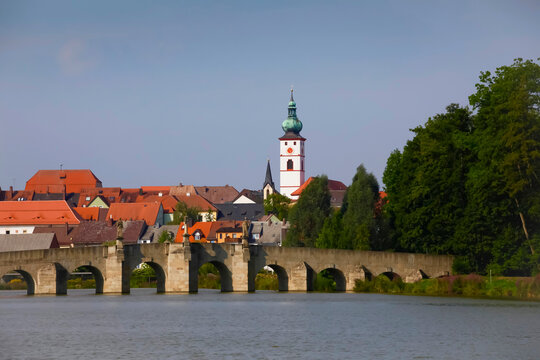 Germany, Bavaria, Tirschenreuth, Arch bridge with bell tower of Parish Church Of The Assumption in background