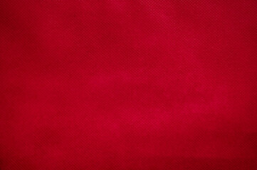 Leere rote Stofftextur als Hintergrund aus Stoff