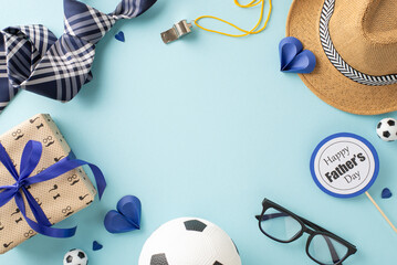 Create bespoke Father's Day wish with top view arrangement featuring straw hat, tie, soccer balls...