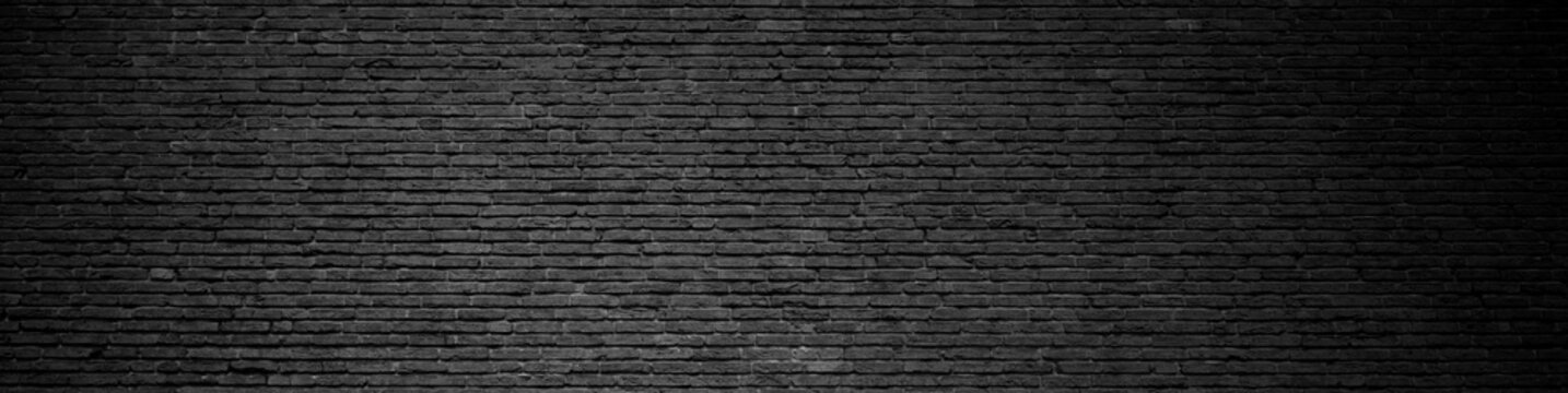 Backsteinwand mit dunkler Farbe als Hintergrund Banner mit alten Steinen