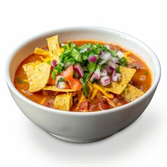 Fototapeta premium A bowl of Mexican Sopa de Tortilla filled with tortilla chips and salsa