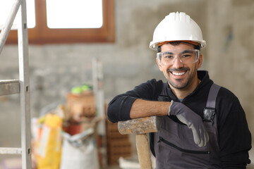 Happy construction worker looking at camera