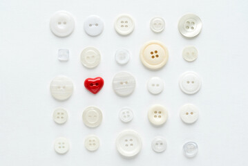 white buttons with red heart