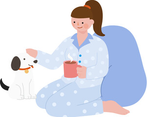 Girl with pajamas sitting and playing with her dog