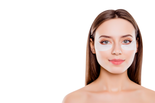 Close up portrait with copy space of pretty charming girl using applying patches under eyes fighting with dark circles isolated over white background. Wellbeing purity advertisement concept