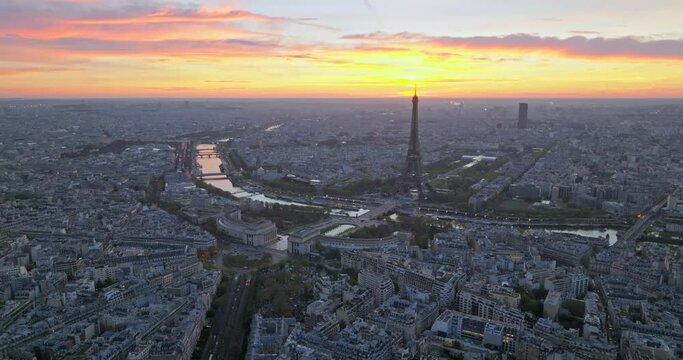 Beautiful view of famous Eiffel Tower in France with colorful twilight romantic sky. Wide establishing aerial morning sunrise or sunset of paris city center best travel destinations landmark in Europe
