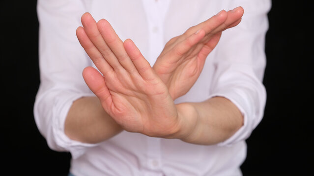 A woman shows gesture of refuse something
