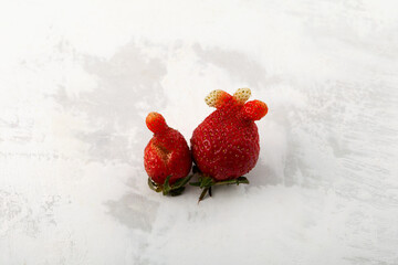 Deformed ugly strawberries of unusual shape. Latest trend - Eating ugly fruits and vegetables....