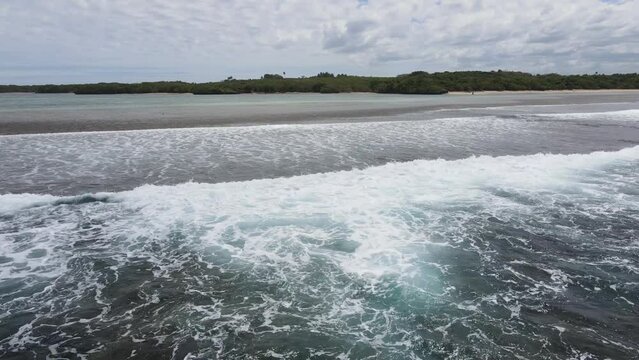 Drone approximation from the pacific ocean towards Natadola beach, Fiji. A serene paradise awaiting exploration.