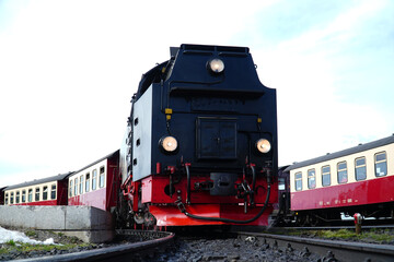 Locomotive of the traditional steam train on the Brocken narrow-gauge railroad in spring in the...