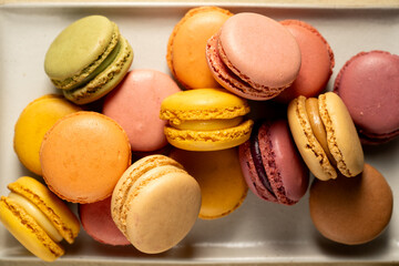 Colorful yellow, pink Macrons closeup. Sweet dessert, sugar