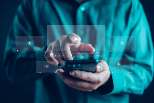 Businessman watching online live stream, live streaming video on internet, digital multimedia player concept.