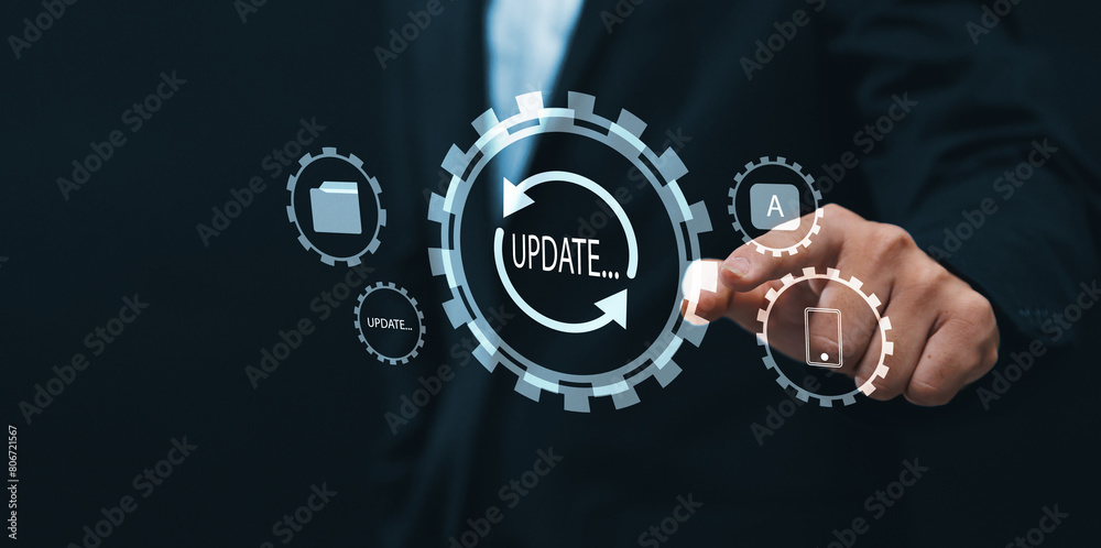 Fototapete Updating computer system software application installation for devices to be up to date with the new version. Hand interacting with graphics icon updating function screen loading on computer laptop.