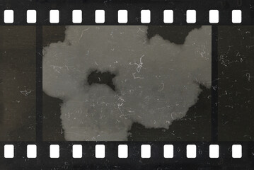 Damaged celluloid filmstrip. Splots, dust and scratches