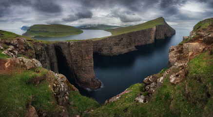 Panorama of Sorvagsvatn lake and cliffs of Traelanipa on Vagar island in sunset, Faroe Islands...