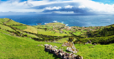 Panorama of Flores island in Azores with Corvo and village Ponta Delgada, Portugal