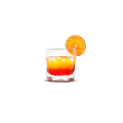 Tequila sunrise with grenadine syrup and orange slice suspended in layers Food and culinary concept