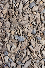 The background is made of small stone. The texture of crushed stone
