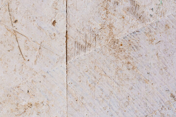 The texture of an old wooden surface covered with white paint