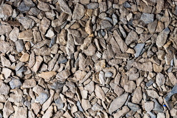 The background is made of small stone. The texture of crushed stone