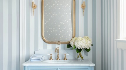 Soft gray and pale blue striped wallpaper in a powder room with pale blue vanity.