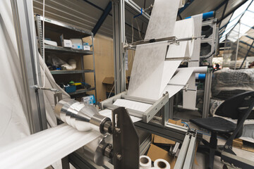 Face Mask production line, automatic machine for the manufacture of medical masks with nanofiber. Coronavirus and Covid-19 Protection. High quality photo