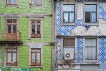Multicolor facades of traditional residencial apartments houses with tiles of Porto, Portugal