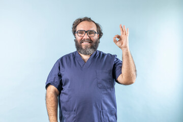 Surgeon doctor smiling man showing  ok sign