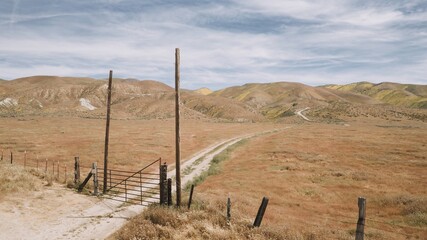 Ranch gate in a desert on Carrizo National Monument, McKittrick, California, United States of America. © Zenstratus