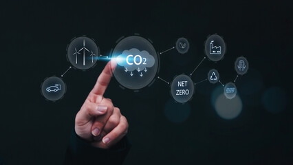 Reducing CO2 emissions and combat global warming and climate change. Businessman planning new ideas and technology for eco-friendly solutions for a sustainable future.