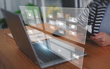 Digital marketing concept with businesswoman using computer laptop creating online adverts to increase sales. Using social media and websites for traffic and awareness, working in a modern office.