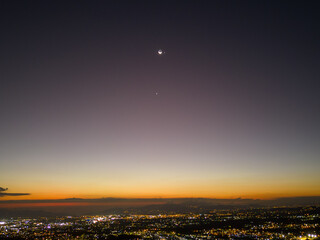 Scenic view of sunset with Moon, Jupiter, and Venus in conjunction