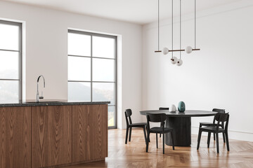 Modern home kitchen interior with bar counter and dining table near window